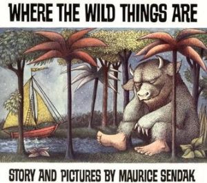 Book Cover of Where the Wild Things Are. A wild thing rests against a tree and there is a sailboat to the left of the picture.
